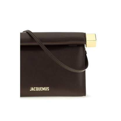 Shoulder Flap Clutch Handbag by Jacquemus for women in nappa leather & cotton brown & gold showcases a sculptural silhouette, featuring a secure flap, zipper & magnetic, ample , and versatile shoulder-strap & handle for a sculptural aesthetic.