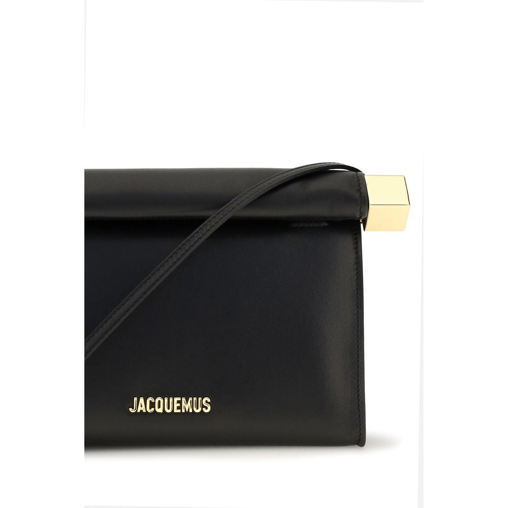 Shoulder Flap Clutch Handbag by Jacquemus for women in cotton & nappa lamb leather black & gold showcases a sculptural silhouette, featuring a secure flap, zipper & magnetic, ample , and versatile shoulder-strap & handle for a sculptural aesthetic.