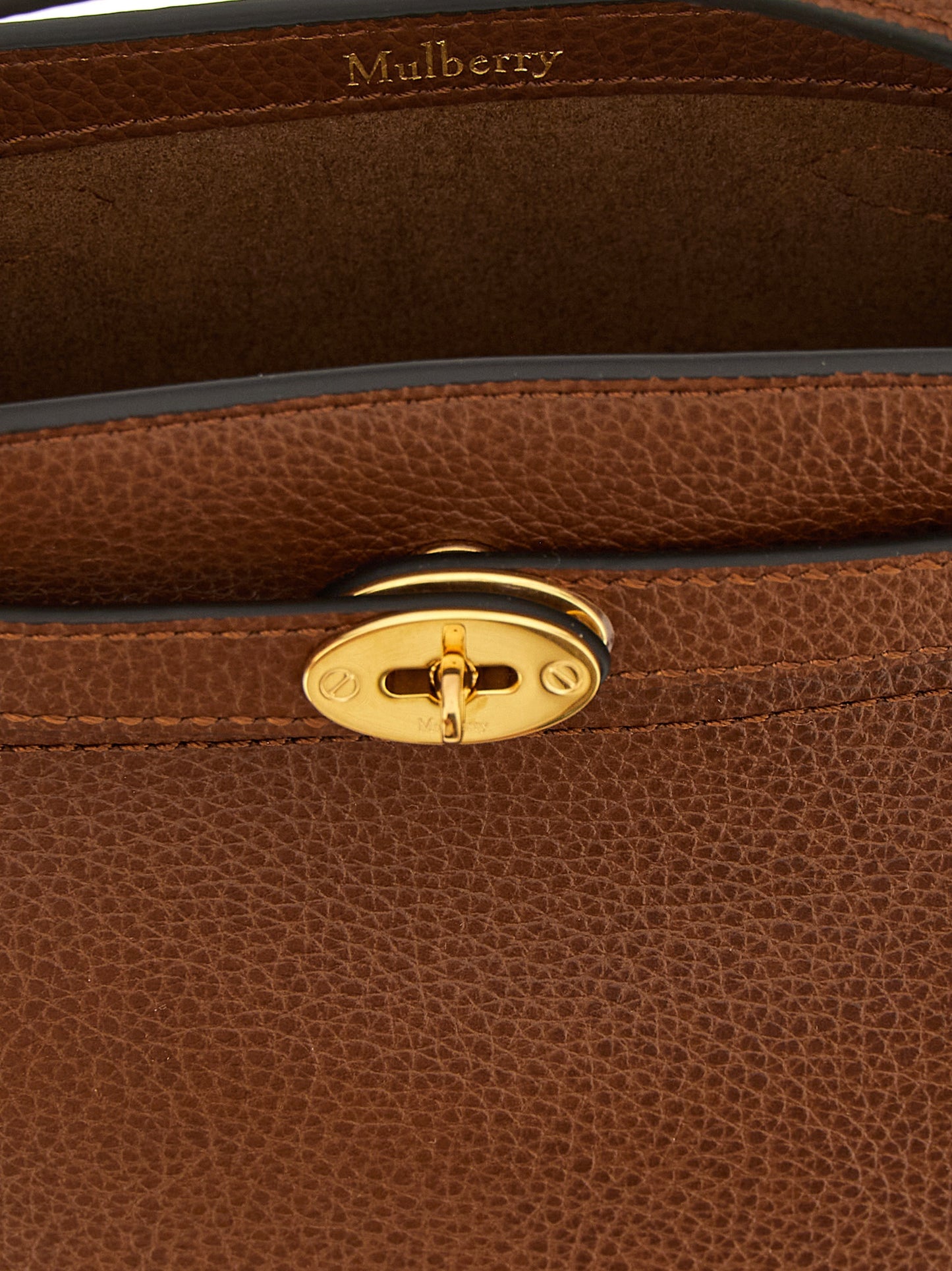 Large Crossbody Bucket Handbag by Mulberry for women in calfskin leather brown & signature features a transformative elegance silhouette, showcasing a secure , organized , and versatile crossbody-strap, shoulder-strap, adjustable-strap, belt-strap & handle for a transformative elegance look.