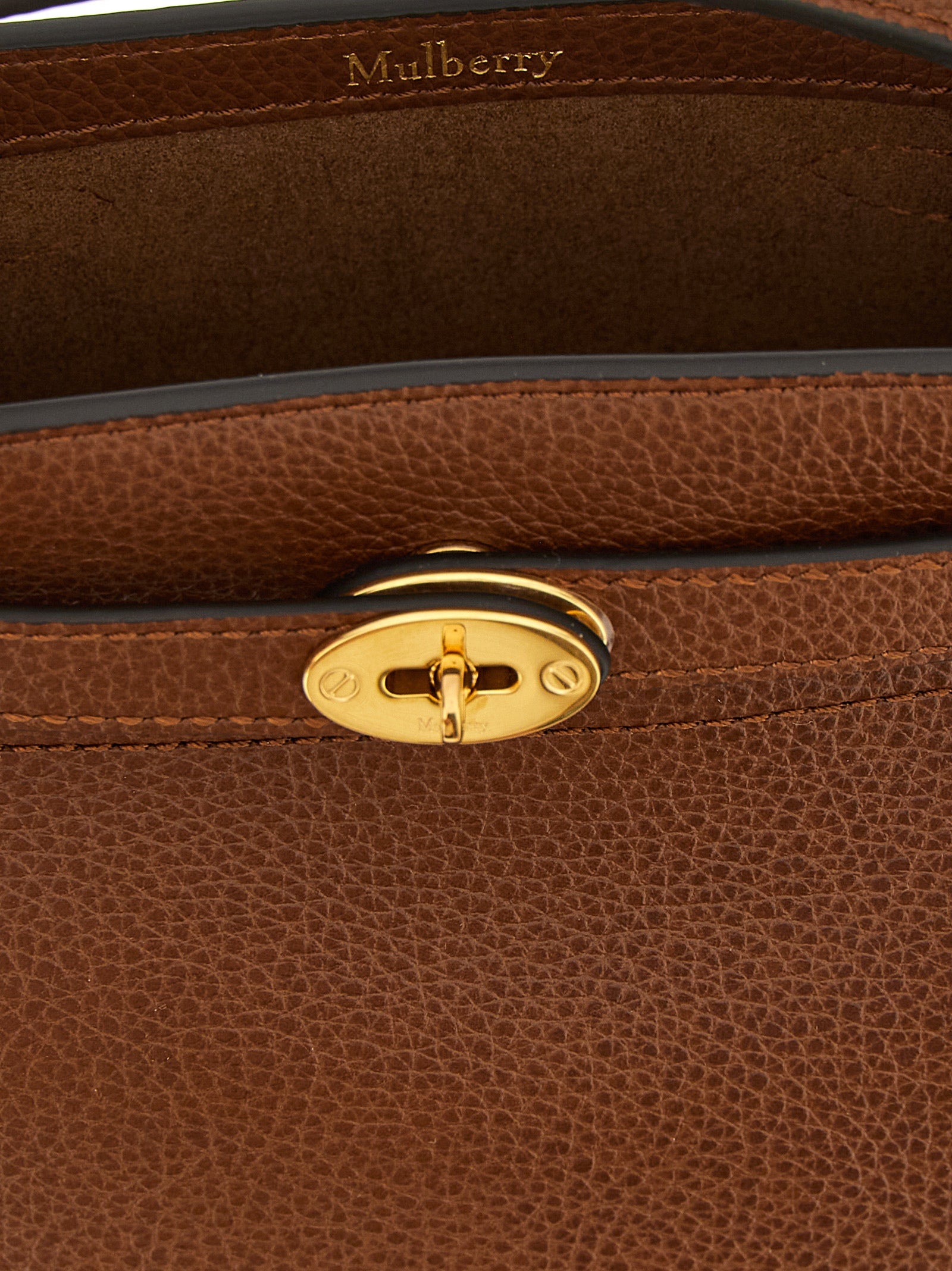 Large Crossbody Bucket Handbag by Mulberry for women in calfskin leather brown & signature features a transformative elegance silhouette, showcasing a secure , organized , and versatile crossbody-strap, shoulder-strap, adjustable-strap, belt-strap & handle for a transformative elegance look.