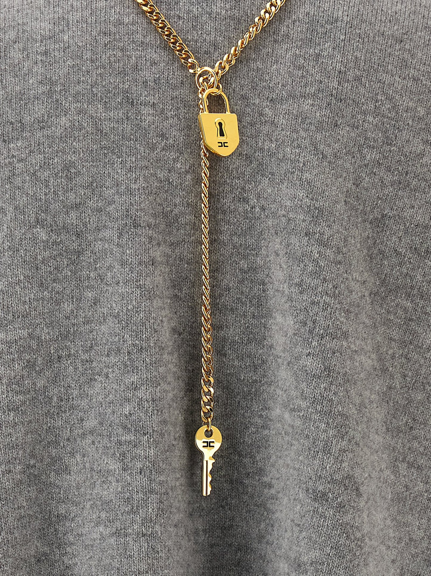 Dress by Elisabetta Franchi for women in polyamide & cashmere gray, gold, signature & monogram features an cute silhouette, detailed with a and that elegantly flows into a cute short.