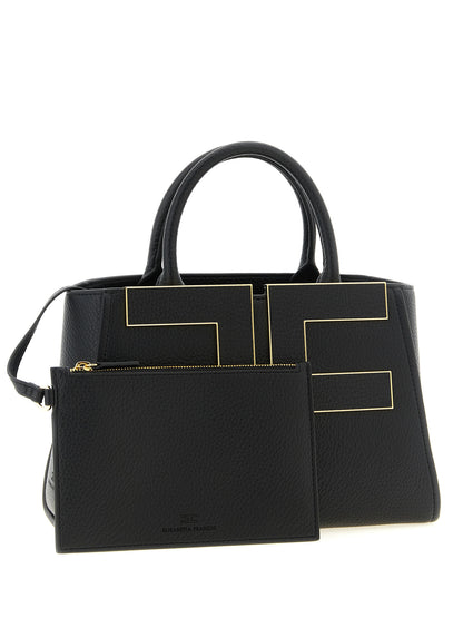 This Tote Clutch Bag by Elisabetta Franchi for women in polyester polyurethane leather black & gold features an on trend Polyester Polyurethane Leather Tote Clutch Bag design with a secure zipper & buckle, ample , and on trend shoulder-strap, adjustable-strap & handle.