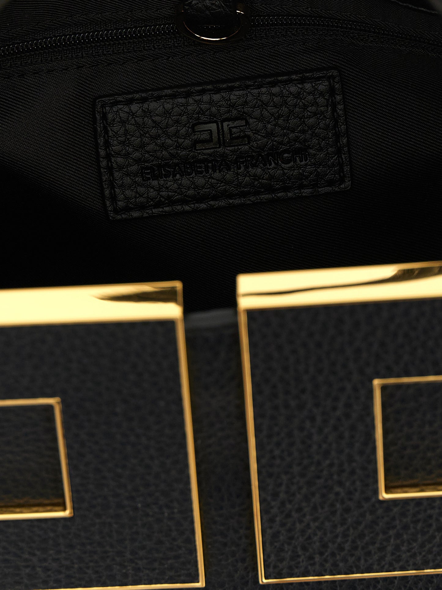 Tote Clutch Bag by Elisabetta Franchi for women in polyester polyurethane leather black & gold features an utilitarian-chic silhouette, showcasing the Polyester Polyurethane Leather Tote Clutch Bag design with a secure zipper & buckle, ample , and versatile shoulder-strap, adjustable-strap & handle.