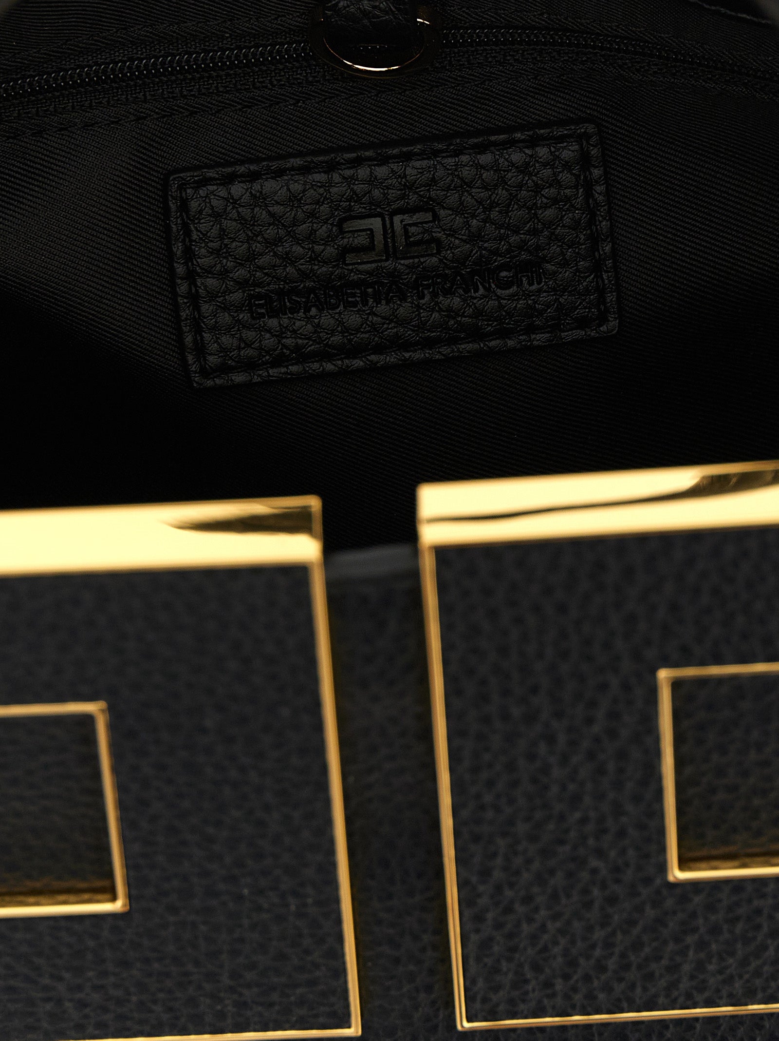 Tote Clutch Bag by Elisabetta Franchi for women in polyester polyurethane leather black & gold features an utilitarian-chic silhouette, showcasing the Polyester Polyurethane Leather Tote Clutch Bag design with a secure zipper & buckle, ample , and versatile shoulder-strap, adjustable-strap & handle.