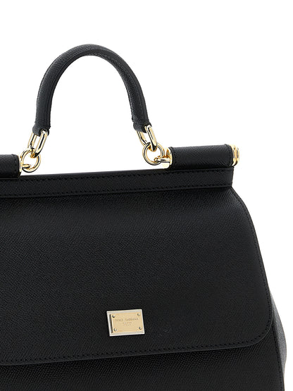 Large Flap Handbag by Dolce & Gabbana for women in calfskin leather black features a contemporary silhouette, showcasing a secure snap & flap, ample , and contemporary shoulder-strap, adjustable-strap & handle for a sophisticated look.