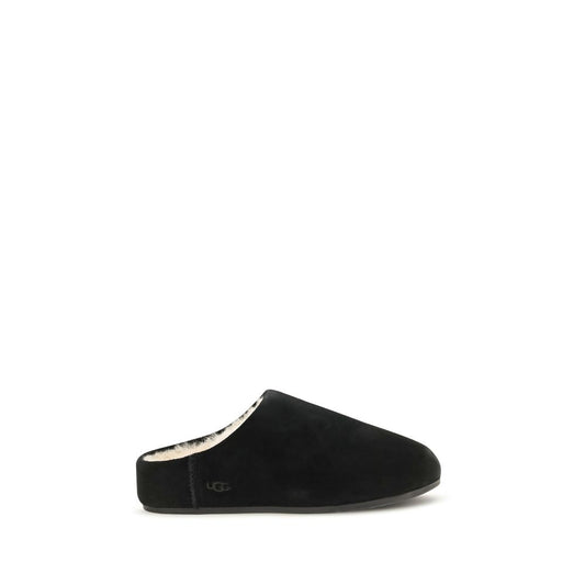Mules Slippers Flat Shoes by UGG for women in suede leather & rubber black & signature features an captivating silhouette, showcasing the captivating style of the Women's Suede Leather & Rubber Mules Slippers Flat Shoes with its distinct and refined .
