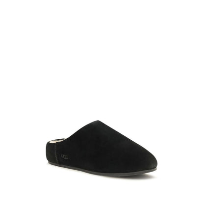 Mules Slippers Flat Shoes by UGG for women in suede leather & rubber black & signature features an statuesque silhouette from the Women's Suede Leather & Rubber Mules Slippers Flat Shoes collection, showcasing a and a statuesque for a statuesque look.