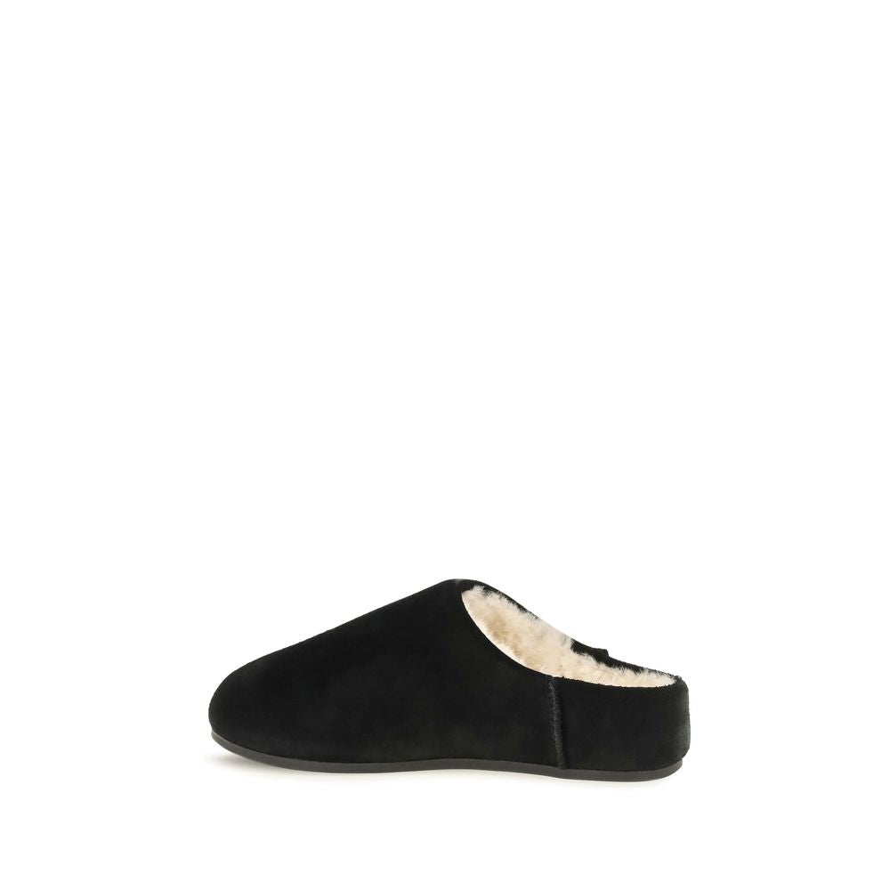 Mules Slippers Flat Shoes by UGG for women in suede leather & rubber black & signature presents a effortless chic silhouette, showcasing the Women's Suede Leather & Rubber Mules Slippers Flat Shoes design with a effortless chic and for a sophisticated look.