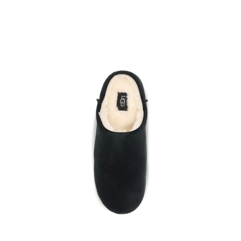 Mules Slippers Flat Shoes by UGG for women in suede leather & rubber black & signature showcases a dynamic silhouette, artfully capturing Women's Suede Leather & Rubber Mules Slippers Flat Shoes through its distinctive and elegant .