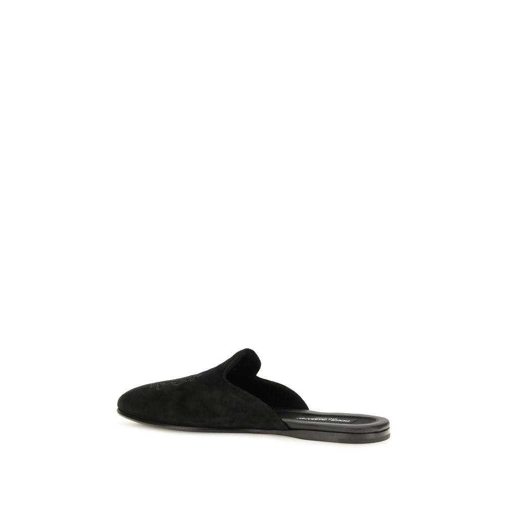 Flat Mule Mules Slip-On Shoes by Dolce & Gabbana for men in bos taurus calfskin leather & tu black features an effortless chic silhouette, showcasing the Men's Bos Taurus Calfskin Leather & TU Flat Mule Mules Slip-On Shoes design with an effortless chic flat and a for a effortless chic look.