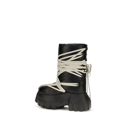 Platform Lace-Up High Knee-High Boots by Rick Owens for women in bos taurus calf leather black features an high-performance silhouette, showcasing the sophisticated design of the Women's Bos Taurus Calf Leather Platform Lace-Up High Knee-High Boots with a platform and a refined .