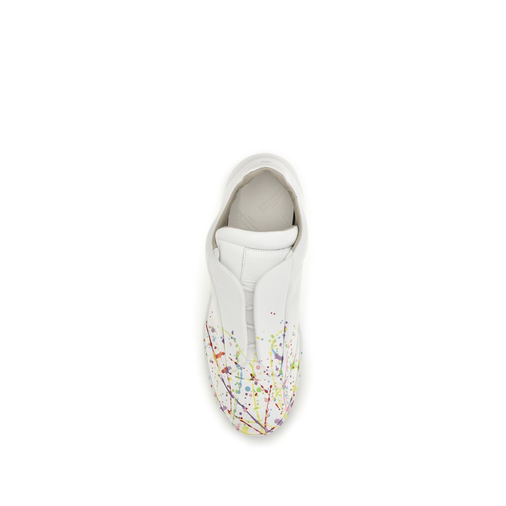 Sneakers by Maison Margiela for men in bos taurus calf patent leather white presents a impeccable silhouette as Men's Low Top Slip On Bos Taurus Calf Patent Leather Sneakers, expertly defined by a impeccable low-top slip-on style for a impeccable, high-fashion look.