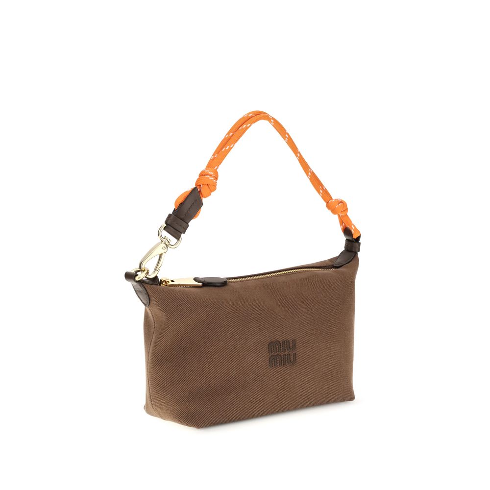 Shoulder Bag by Miu Miu for women in cotton brown & monogram presents a versatile silhouette, showcasing a secure snap, zipper & hook and versatile single-compartment with versatile shoulder-strap & handle for a sophisticated look.