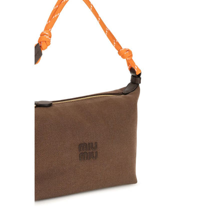 Shoulder Bag by Miu Miu for women in cotton brown & monogram showcases a enviable silhouette, artfully detailed with a secure snap, zipper & hook, organized single-compartment, and versatile shoulder-strap & handle for a enviable look.