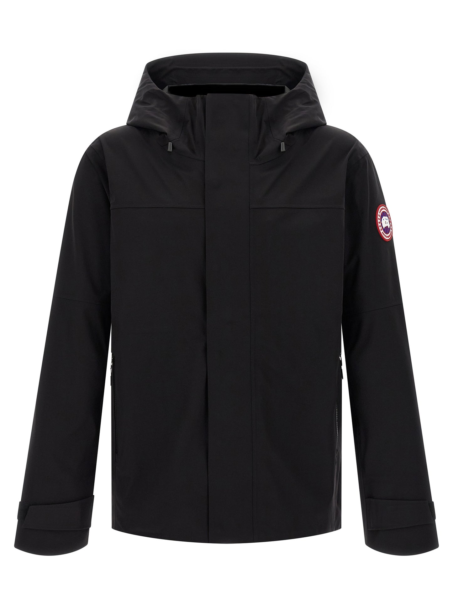 Hooded Rain Coat by Canada Goose for men in stretch polyamide black features an impenetrable silhouette, perfectly blending water-resistant, pockets, hooded & windproof with a sophisticated hooded neckline for a impenetrable finish.