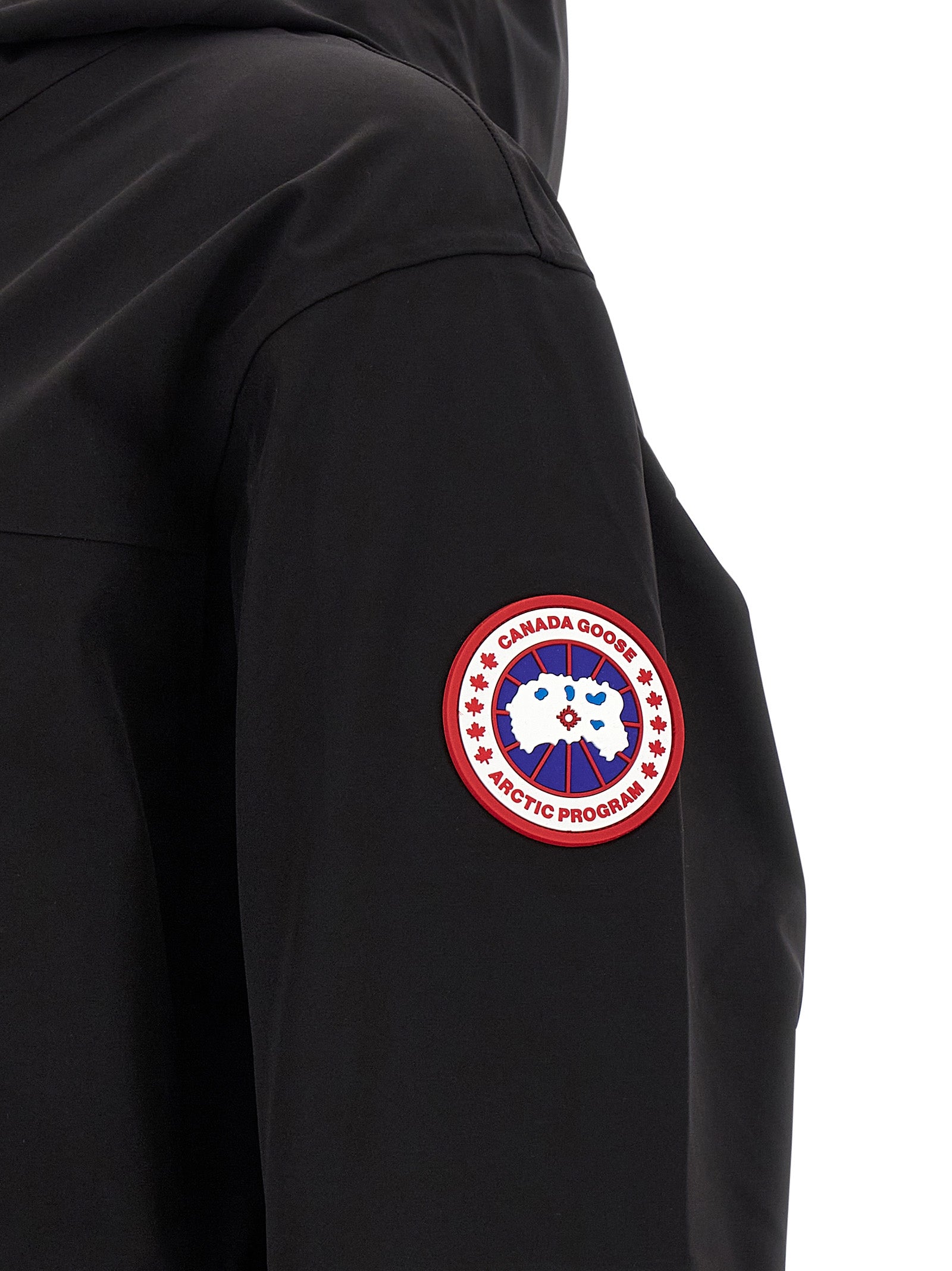 Hooded Rain Coat by Canada Goose for men in stretch polyamide black features an impenetrable silhouette, perfectly blending water-resistant, pockets, hooded & windproof with a sophisticated for a impenetrable finish.