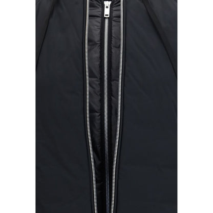 Hooded Bomber Jacket by Moose Knuckles for women in nylon & duck-down black features a dramatic silhouette, showcasing a sophisticated hooded neckline and distinctive breathable-design, pockets, hooded & insulated for a dramatic aesthetic.
