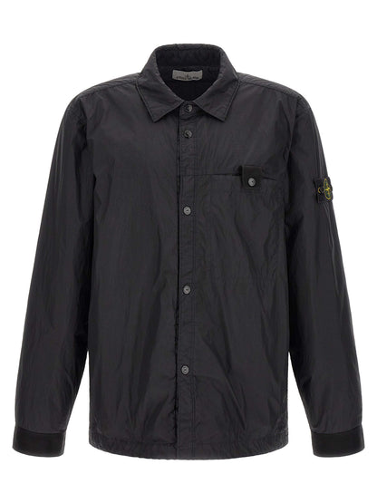Windbreaker Jacket by Stone Island for men in nylon & resin black & signature presents a resilient silhouette, artfully detailed with a sophisticated shirt-collar neckline and functional lightweight & windproof for a resilient finish.