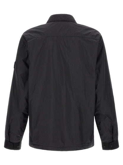 Windbreaker Jacket by Stone Island for men in nylon & resin black & signature features an enduring silhouette, showcasing technical lightweight & windproof and a sophisticated shirt-collar neckline for a truly enduring aesthetic.