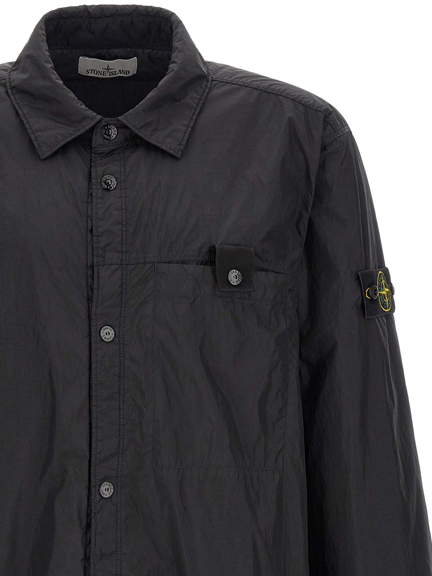 Windbreaker Jacket by Stone Island for men in nylon & resin black & signature showcases a urban chic silhouette, detailed with a urban chic shirt-collar neckline and functional lightweight & windproof for a polished finish.