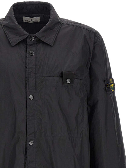 Windbreaker Jacket by Stone Island for men in nylon & resin black & signature showcases a urban chic silhouette, detailed with a urban chic shirt-collar neckline and functional lightweight & windproof for a polished finish.