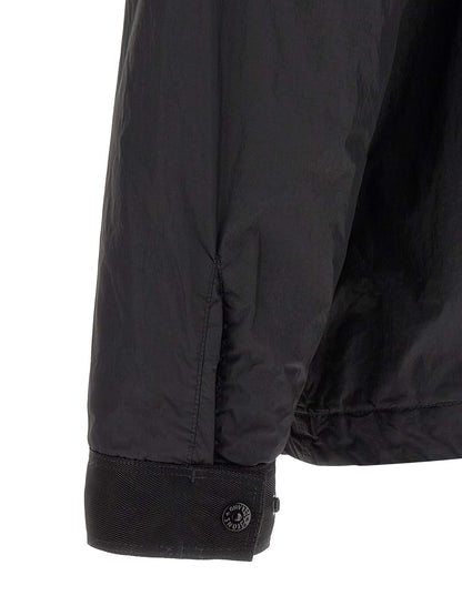 Windbreaker Jacket by Stone Island for men in nylon & resin black & signature showcases a urban chic silhouette, detailed with a urban chic shirt-collar neckline and functional lightweight & windproof for a polished finish.