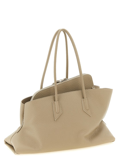 Medium Shoulder Bag by The Attico for women in bos taurus suede calf leather beige & sand showcases a enviable silhouette, artfully detailed with a secure zipper, organized , and versatile shoulder-strap & handle for a enviable look.
