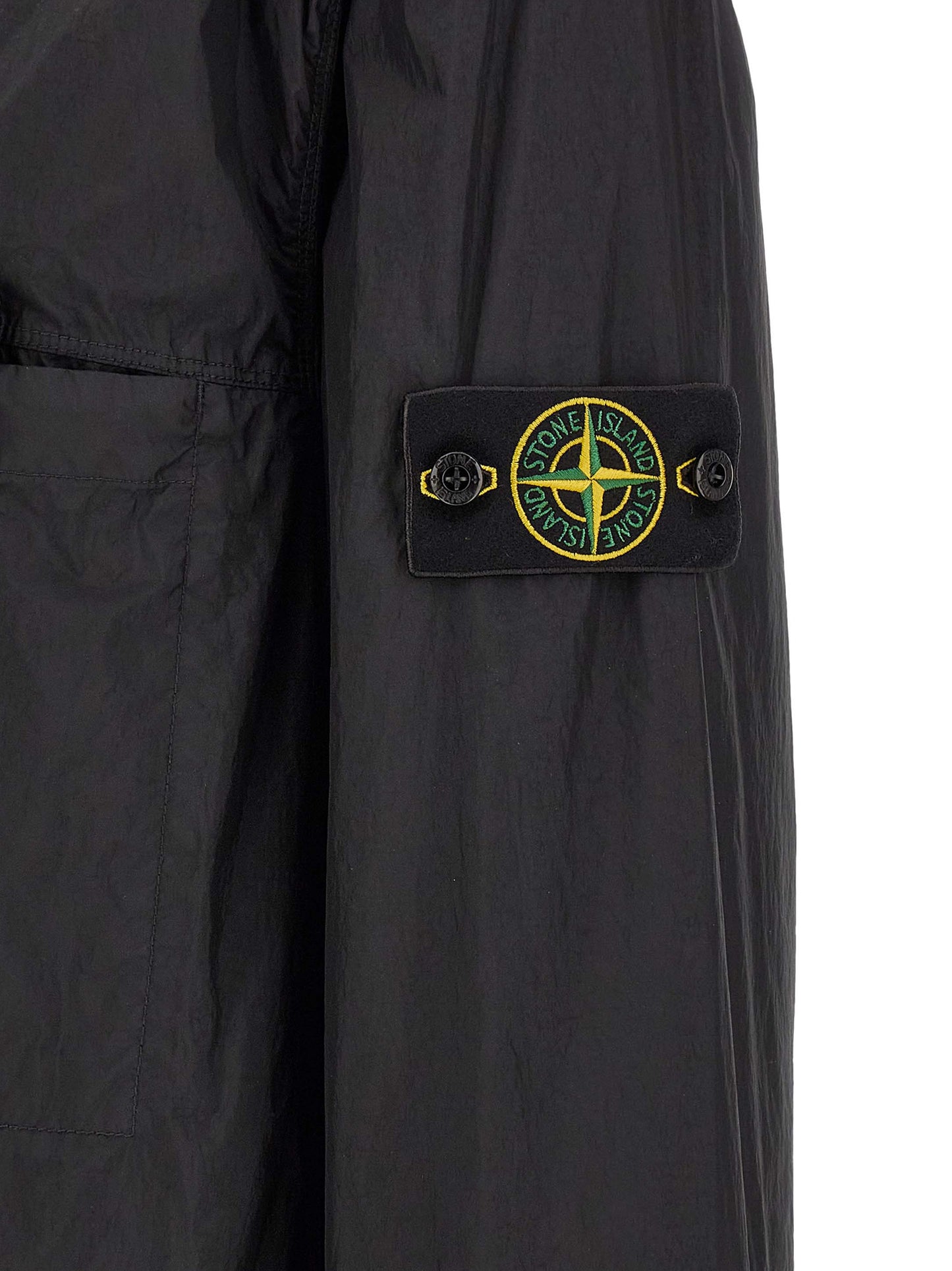 Windbreaker Jacket by Stone Island for men in nylon & resin black & signature features an enduring silhouette, showcasing technical lightweight & windproof and a sophisticated for a truly enduring aesthetic.