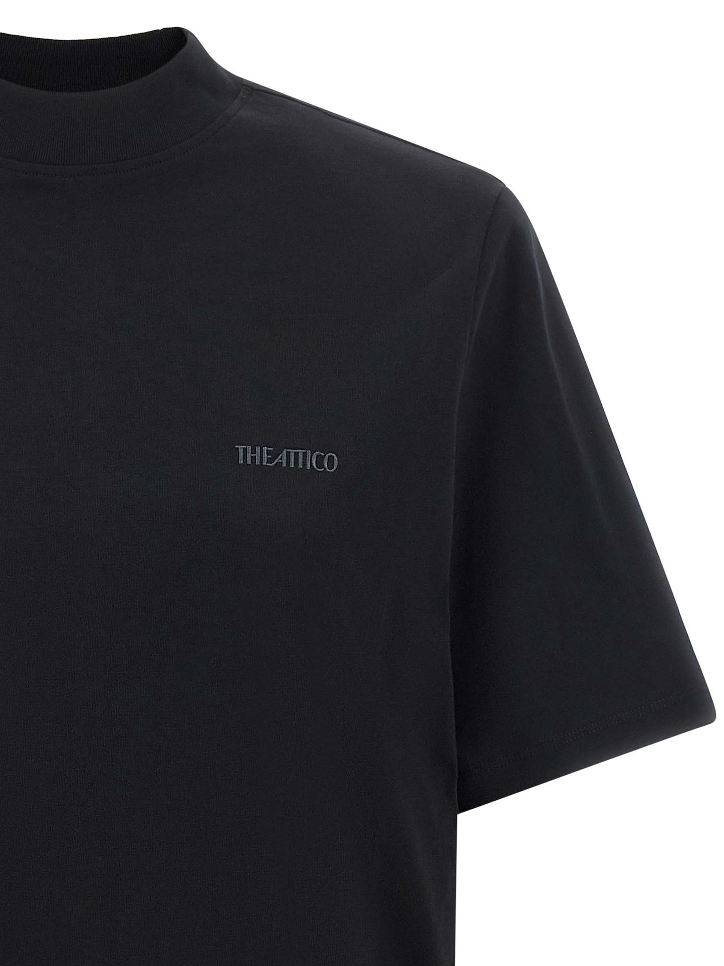 T-Shirt by The Attico for women in cotton black showcases a fashionable silhouette, elegantly detailed with a fashionable and mock neckline for a sophisticated, high-fashion look.