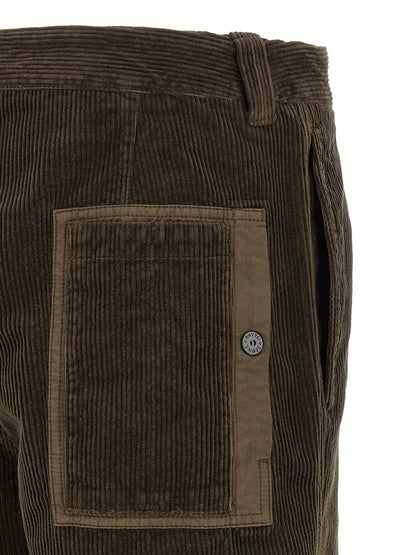 Casual Pants by Stone Island for men in organic cotton corduroy canvas charcoal & gray presents a tailored silhouette, showcasing a tailored and long cut with a refined for a truly tailored aesthetic.