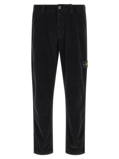 Trousers by Stone Island for men in organic cotton corduroy black presents a perennial silhouette, meticulously tailored with a cut, long finish, and an elegant .