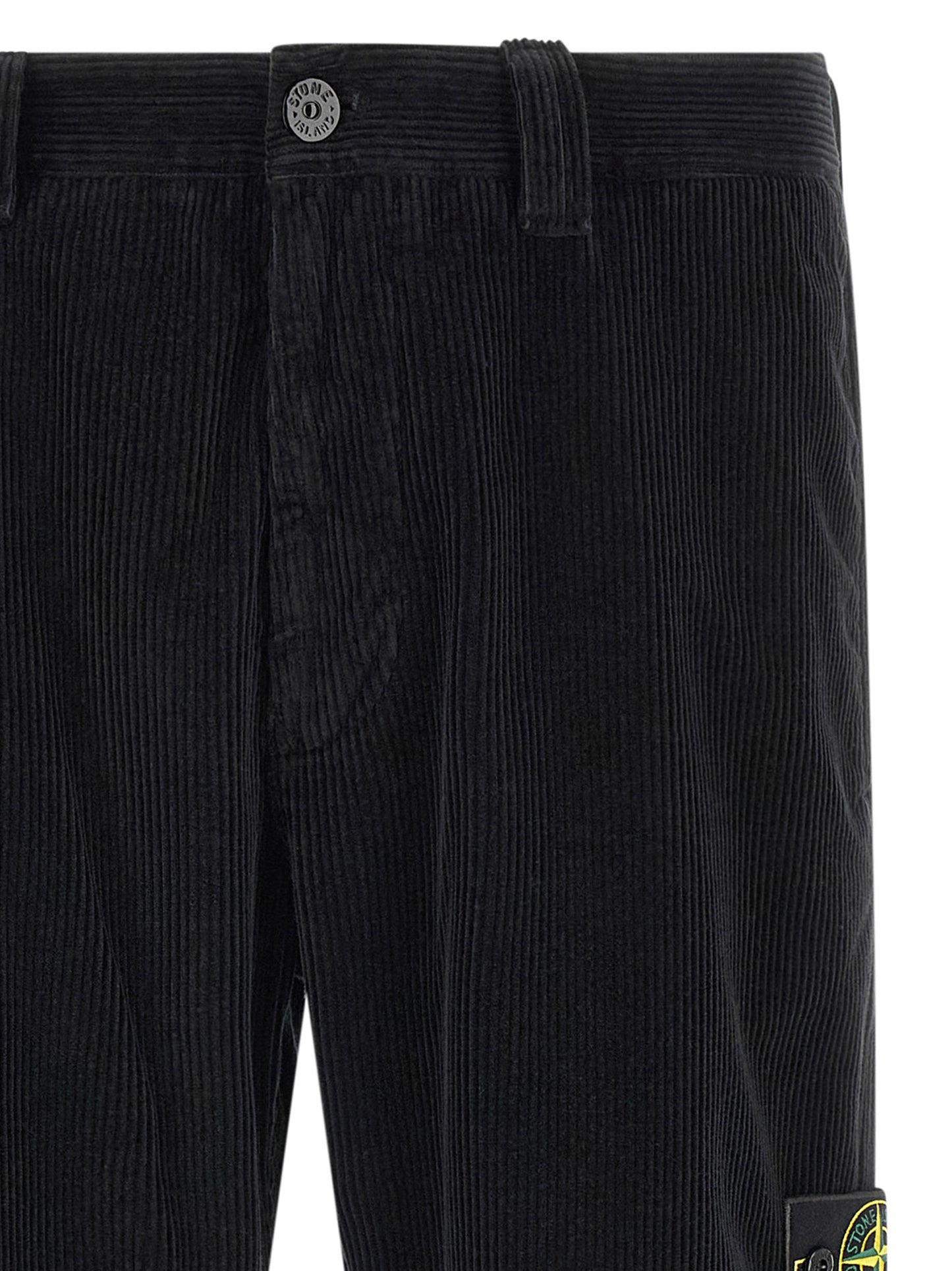 Trousers by Stone Island for men in organic cotton corduroy black features a sculptural silhouette, showcasing a sculptural and long with a sophisticated for a sculptural finish.