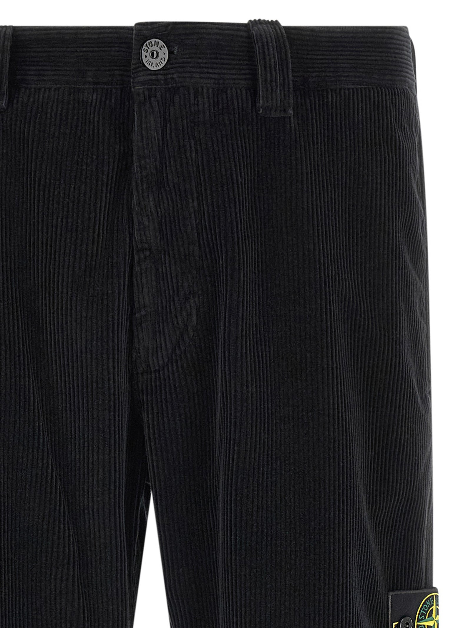 Trousers by Stone Island for men in organic cotton corduroy black features a sculptural silhouette, showcasing a sculptural and long with a sophisticated for a sculptural finish.