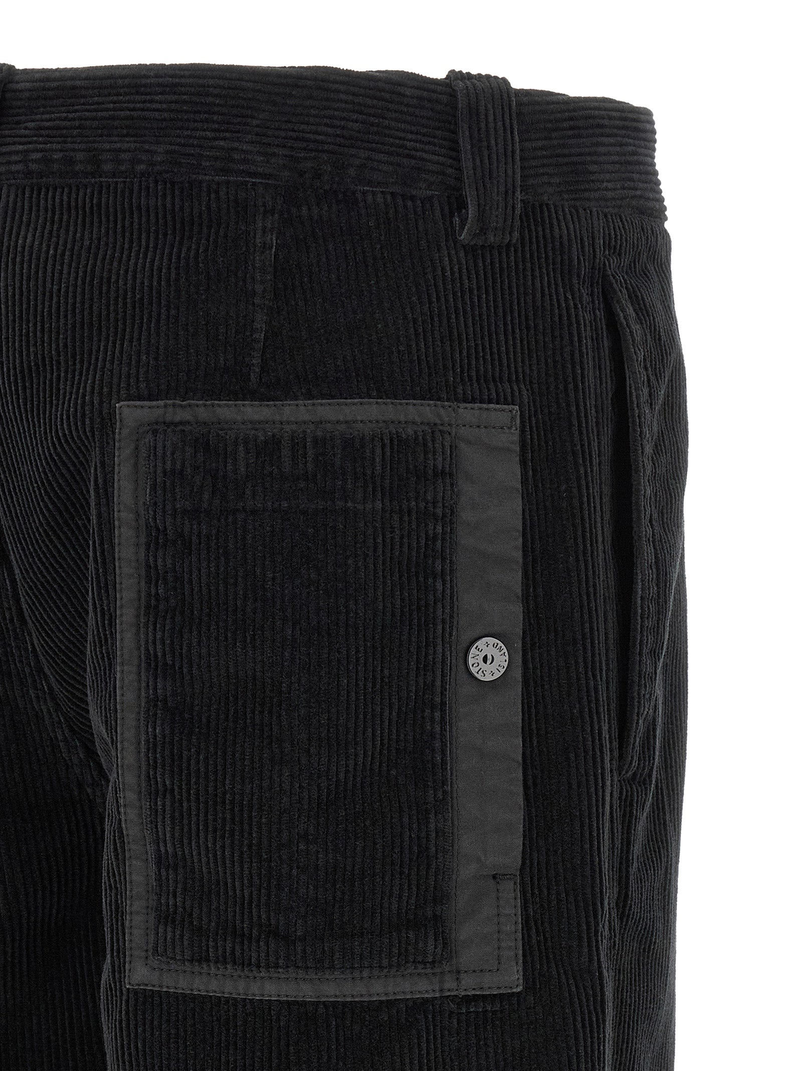 Trousers by Stone Island for men in organic cotton corduroy black features an sartorial silhouette, showcasing a precise and long with a sartorial for a refined look.