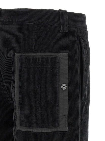 Trousers by Stone Island for men in organic cotton corduroy black features an sartorial silhouette, showcasing a precise and long with a sartorial for a refined look.