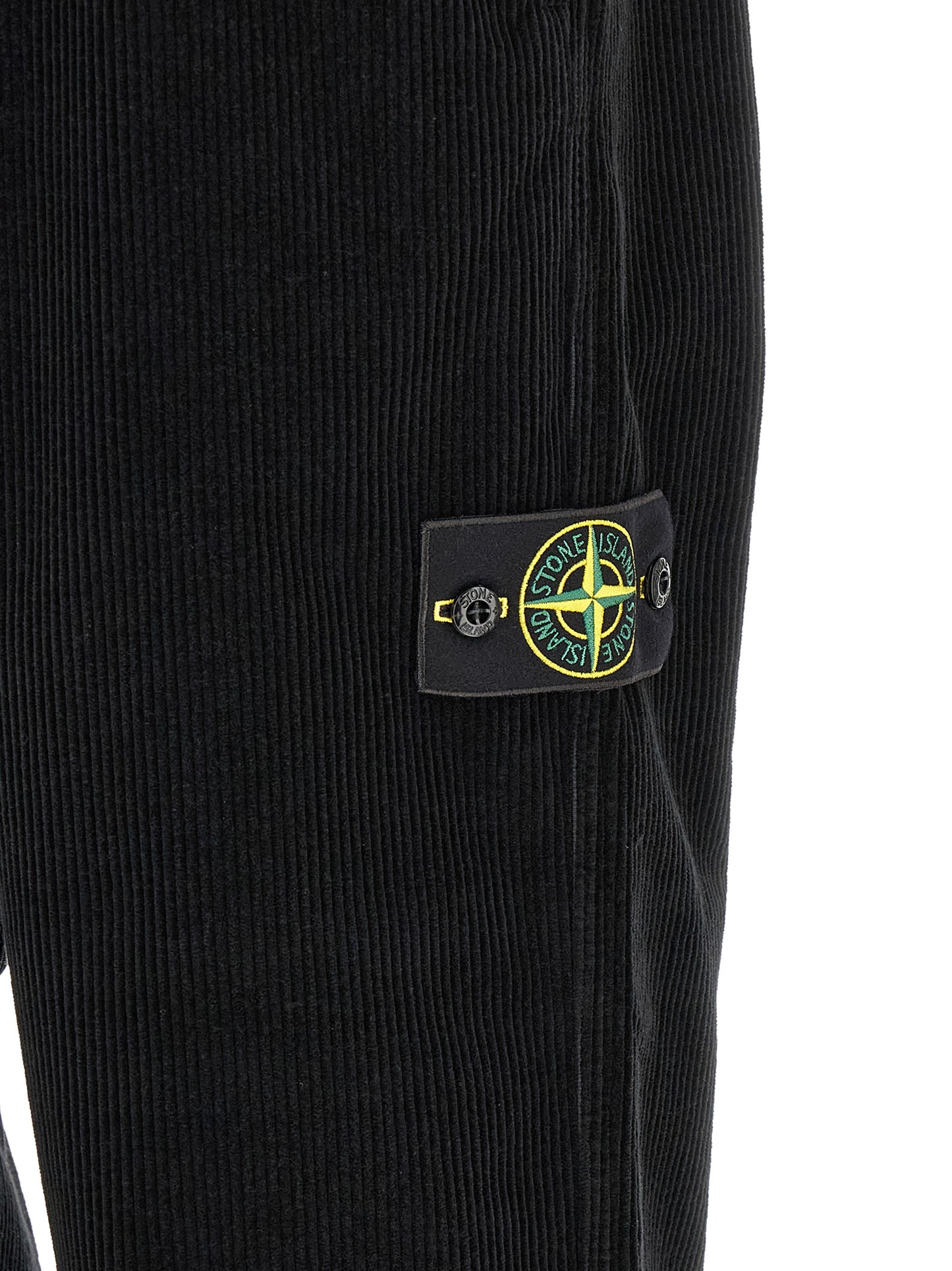 Trousers by Stone Island for men in organic cotton corduroy black features a tailored silhouette with a tailored , defined by its long and a sophisticated .