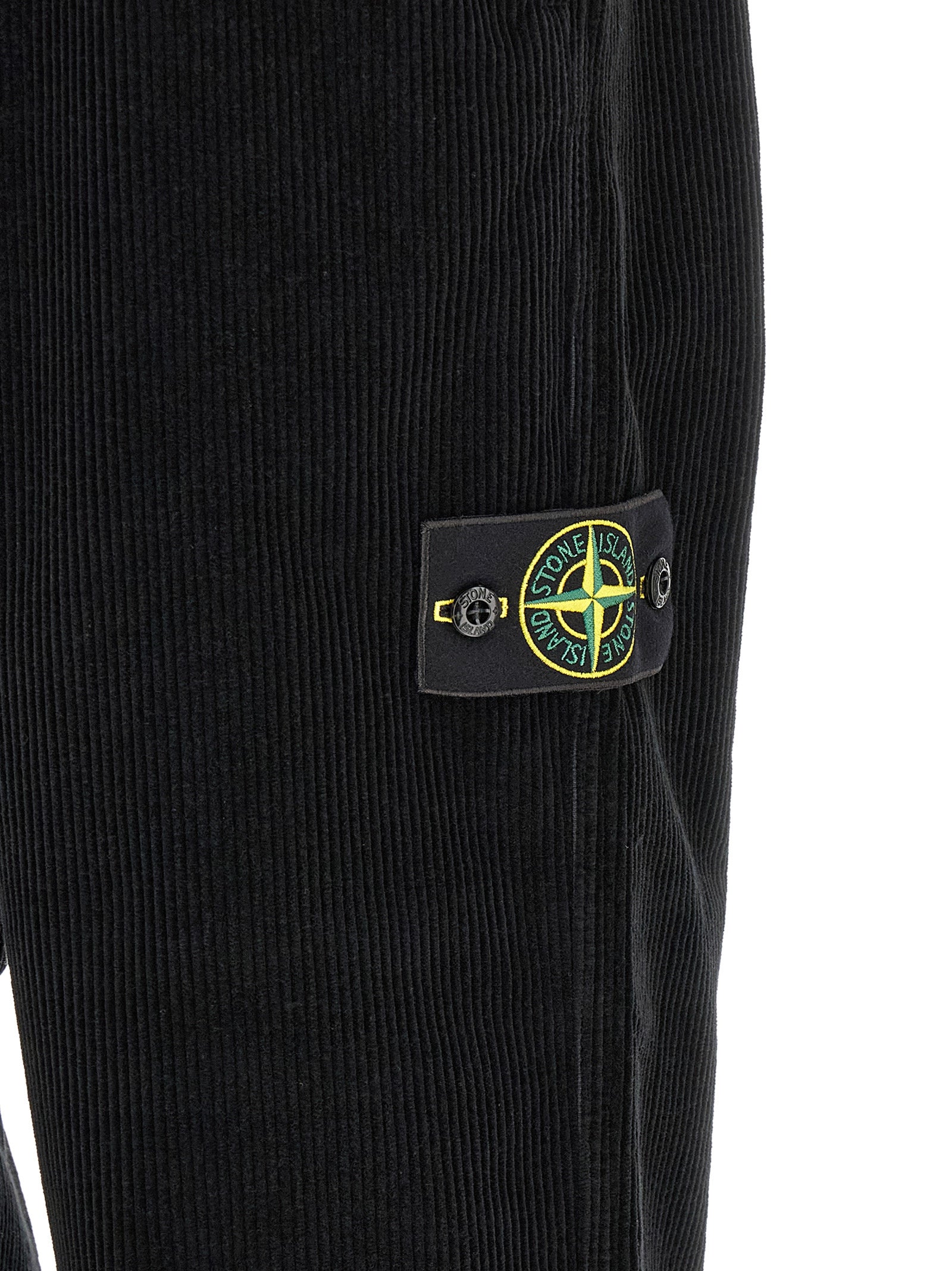 Trousers by Stone Island for men in organic cotton corduroy black features a tailored silhouette with a tailored , defined by its long and a sophisticated .