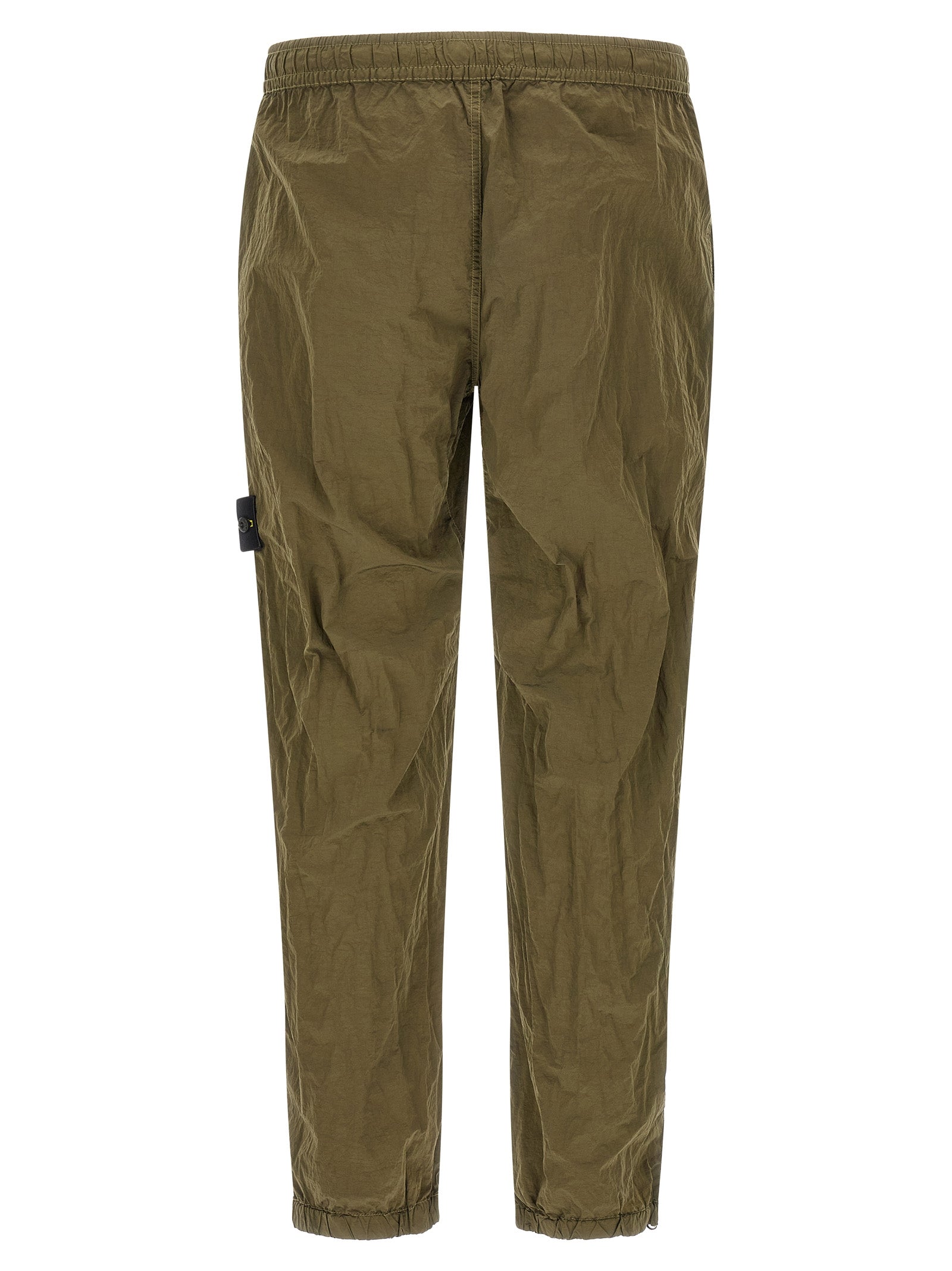 Joggers by Stone Island for men in nylon bicolour, green & olive presents a refined pantology silhouette, artfully defined by a refined pantology athletic, long, and a sophisticated .