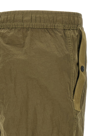 Joggers by Stone Island for men in nylon bicolour, green & olive features an sophisticated and athletic with a precise long, creating a sophisticated and sophisticated silhouette.