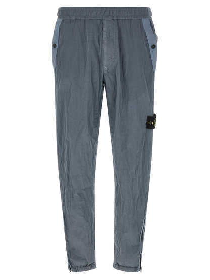 Joggers by Stone Island for men in nylon gray features an sartorial and long with a cut for a sartorial finish.