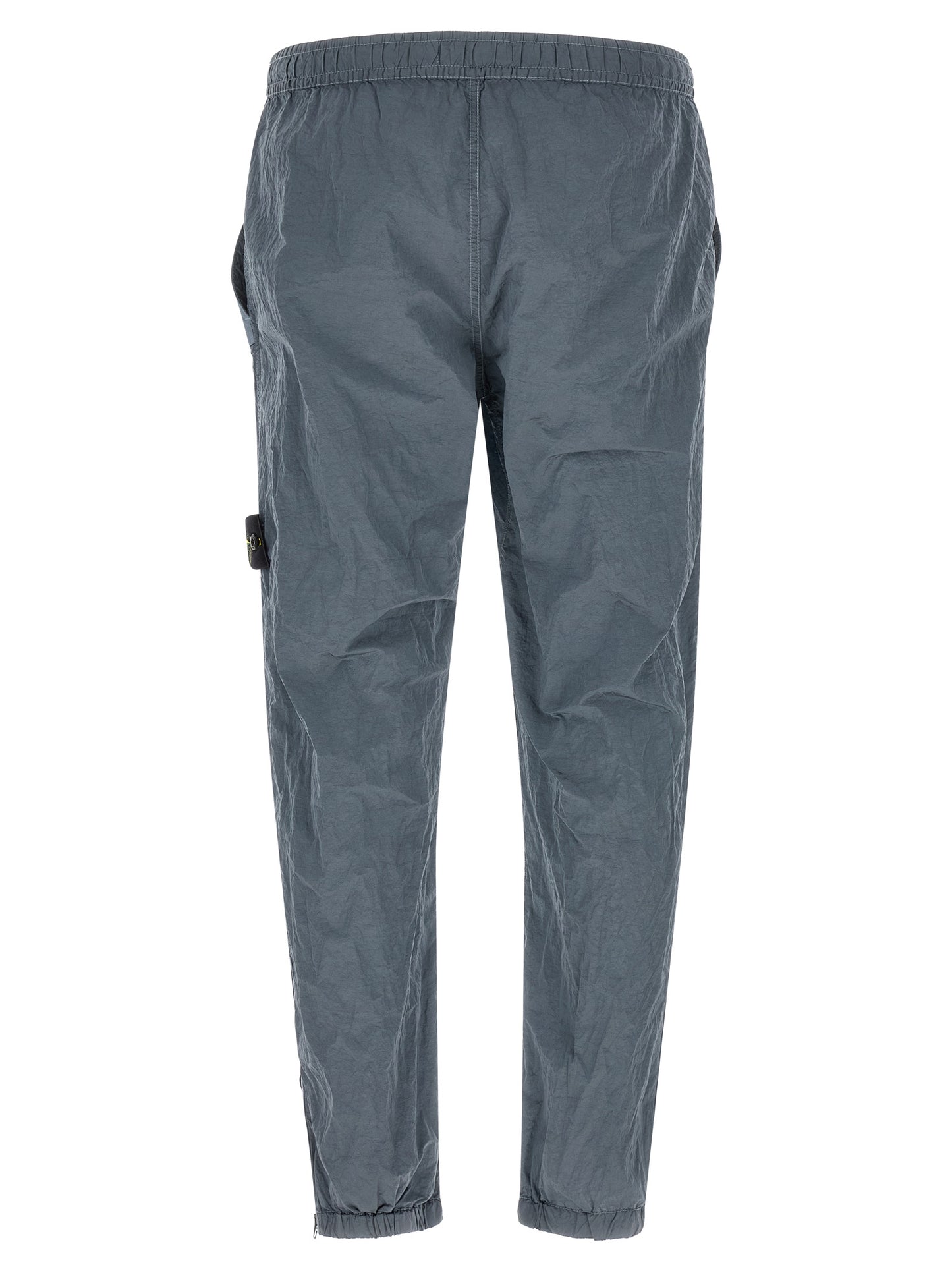 Joggers by Stone Island for men in nylon gray features a refined silhouette with a refined , defined by a and a refined long for a refined finish.