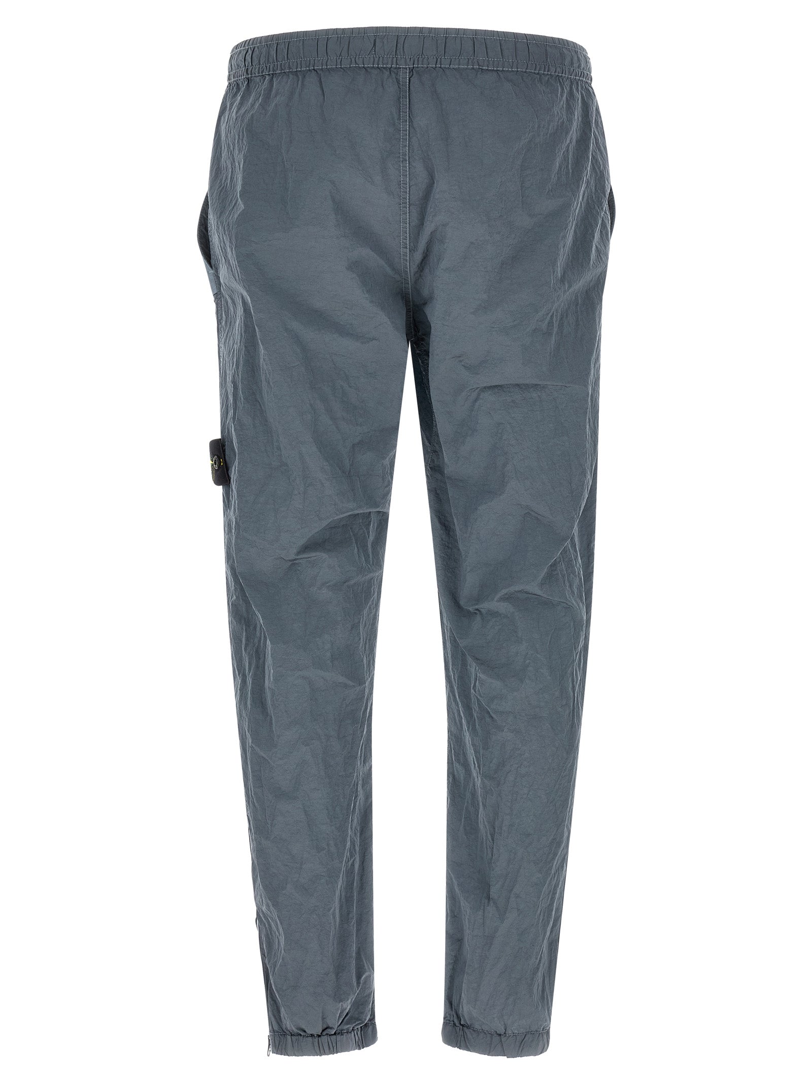 Joggers by Stone Island for men in nylon gray features a refined silhouette with a refined , defined by a and a refined long for a refined finish.