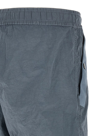 Joggers by Stone Island for men in nylon gray features a refined silhouette with a refined , defined by a and a refined long for a refined finish.