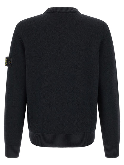 Cardigan by Stone Island for men in virgin wool blue showcases a luxurious silhouette, meticulously detailed with a sophisticated crew neckline and for a refined finish.