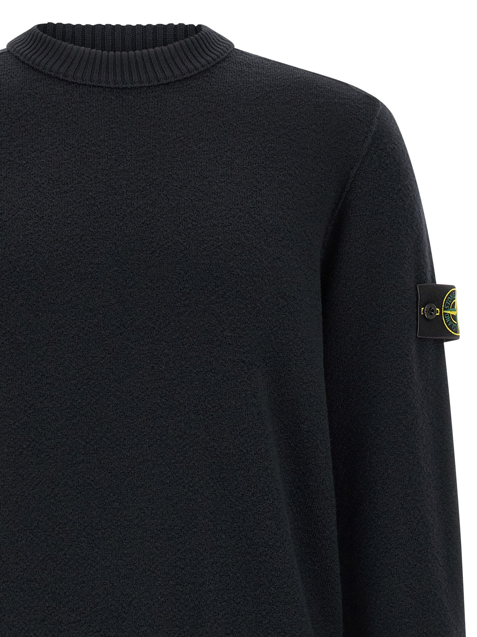 Cardigan by Stone Island for men in virgin wool blue features an impeccable silhouette, showcasing a sophisticated crew neckline and detail for a truly impeccable finish.