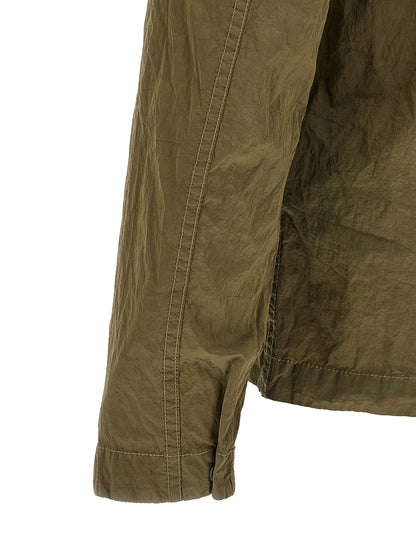 Overshirt by Stone Island for men in nylon bicolour, green & olive showcases a sharp silhouette, elegantly detailed with a sharp and sharp .