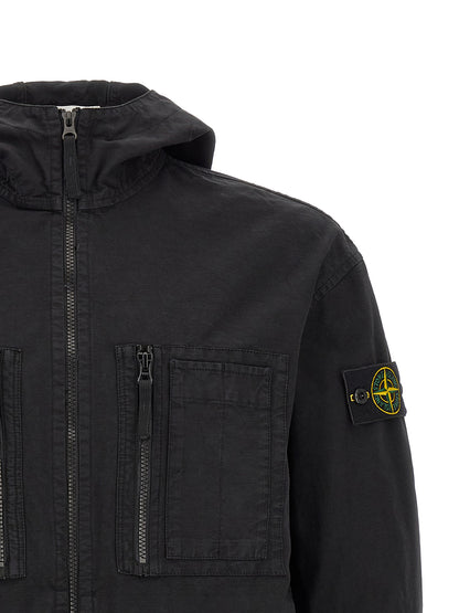 Hooded Windbreaker Jacket by Stone Island for men in cotton black features an stylish silhouette, showcasing a sophisticated hooded neckline and performance-driven pockets, hooded & windproof for a premium, stylish look.