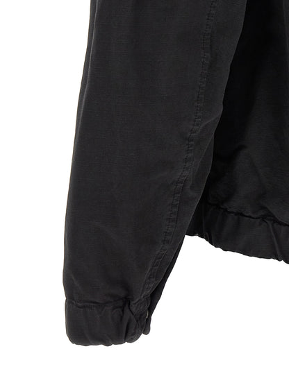 Hooded Windbreaker Jacket by Stone Island for men in cotton black features an magnificent silhouette, showcasing the sophisticated hooded neckline and functional pockets, hooded & windproof for a premium, magnificent look.