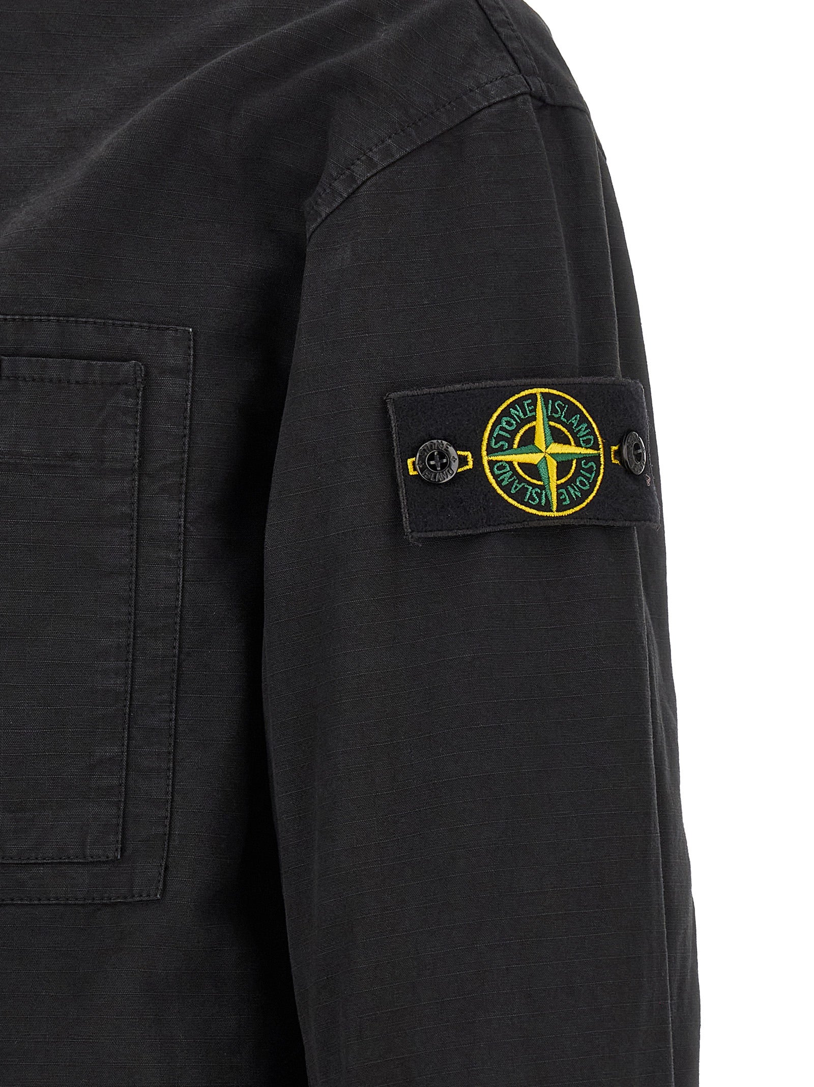 Hooded Windbreaker Jacket by Stone Island for men in cotton black features an stylish silhouette, showcasing a sophisticated and performance-driven pockets, hooded & windproof for a premium, stylish look.