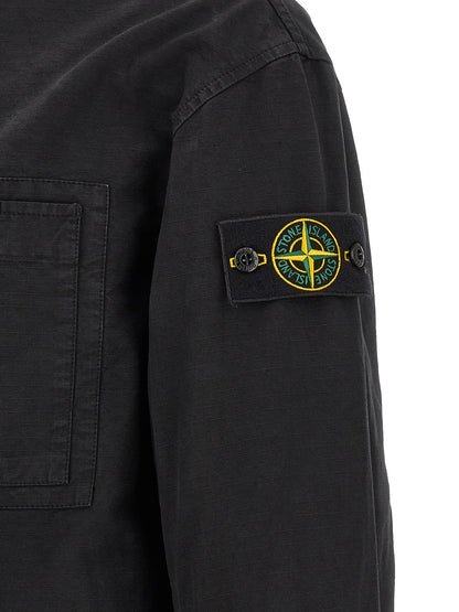 Hooded Windbreaker Jacket by Stone Island for men in cotton black features an stylish silhouette, showcasing a sophisticated and performance-driven pockets, hooded & windproof for a premium, stylish look.